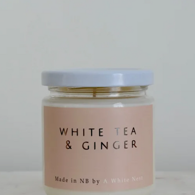 A white Nest White Tea & Ginger Soy Candle